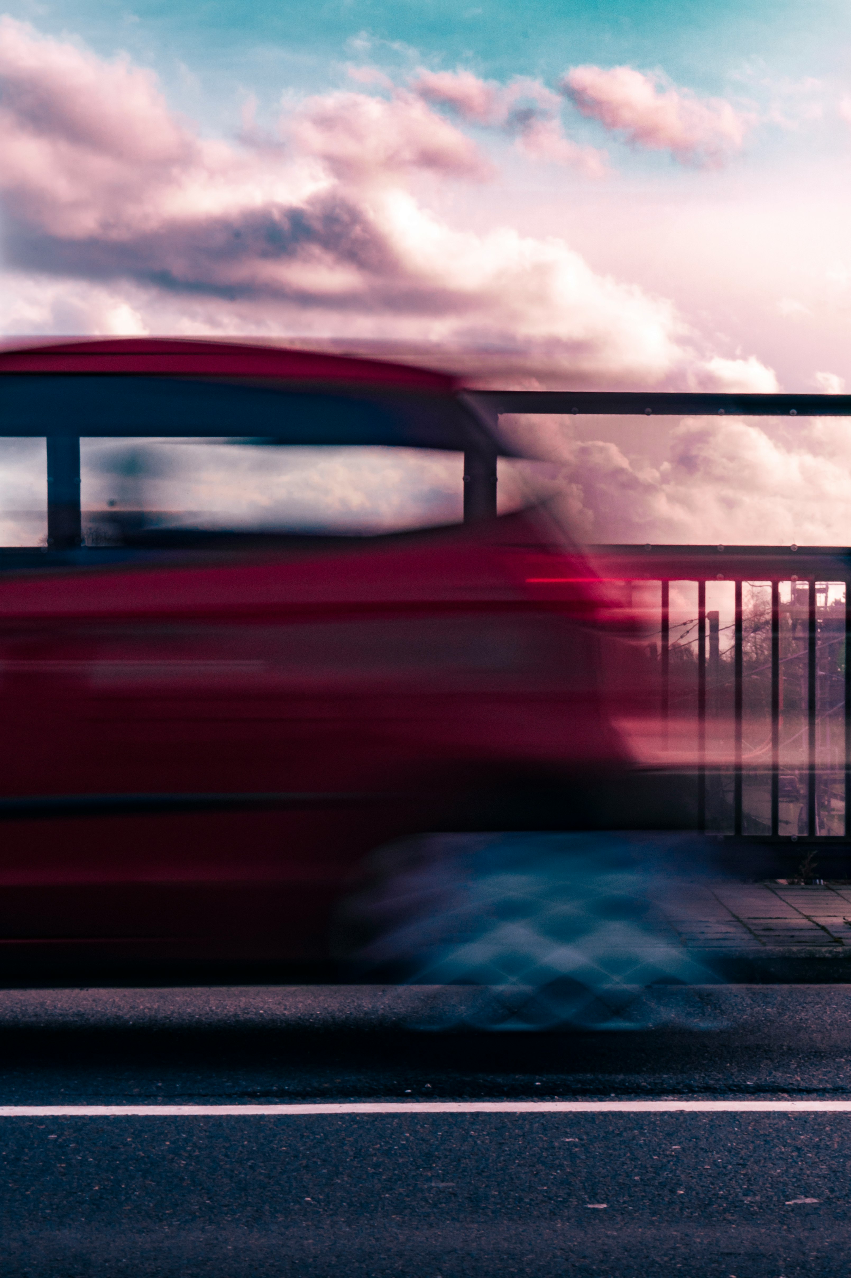 red car on gray road